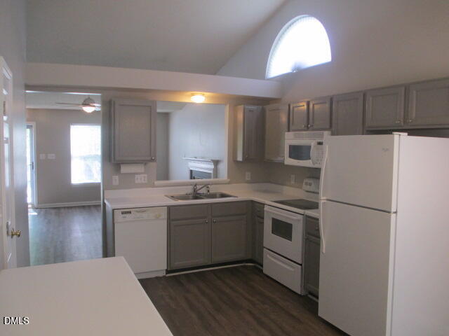 5409 Botany Bay Drive Raleigh, NC 27616 - Photo 6 of 14 a kitchen with a sink a refrigerator and cabinets