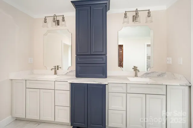 a white bath tub sitting next to a white sink