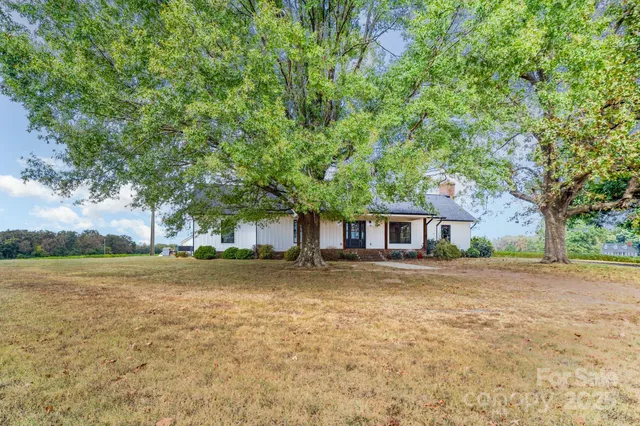 a house with a tree in front of it