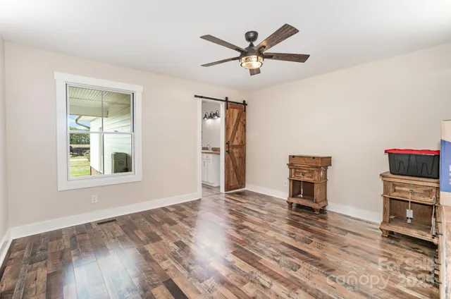 a spacious bathroom with a granite countertop sink toilet and shower