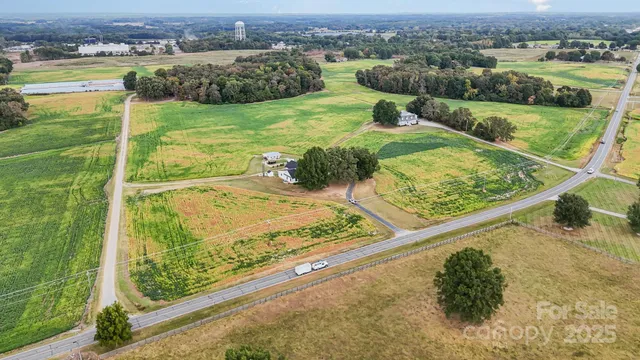 a view of a swimming pool with a yard