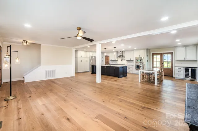 a view of kitchen and dining room with wooden floor