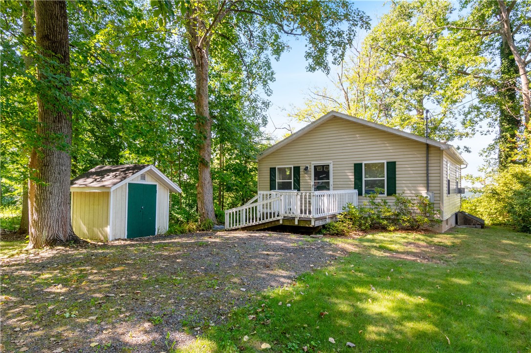 6925 Emerald Point Road Sodus, NY 14555 - Photo 2 of 32 The driveway entrance- even a shed for lots of sto