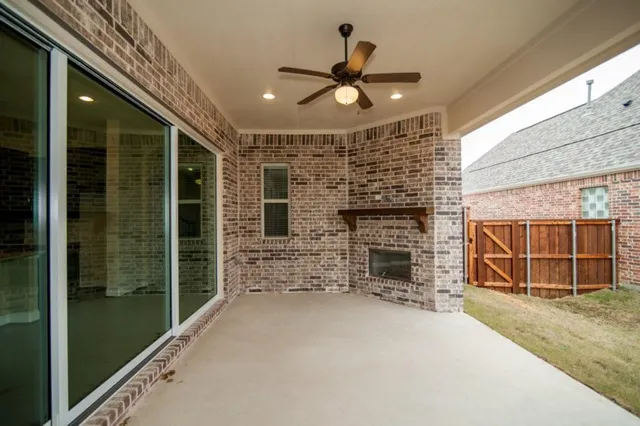 a view of a livingroom with a ceiling fan and window