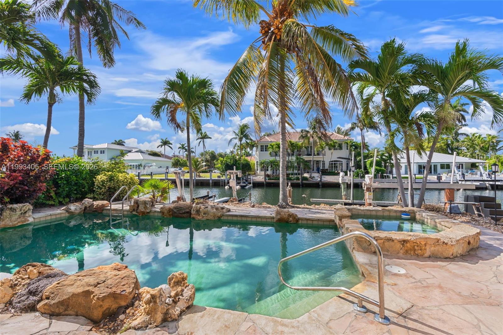 2858 Northeast 33rd Street Lighthouse Point, FL 33064 - Photo 3 of 24 a view of swimming pool with a table and chairs