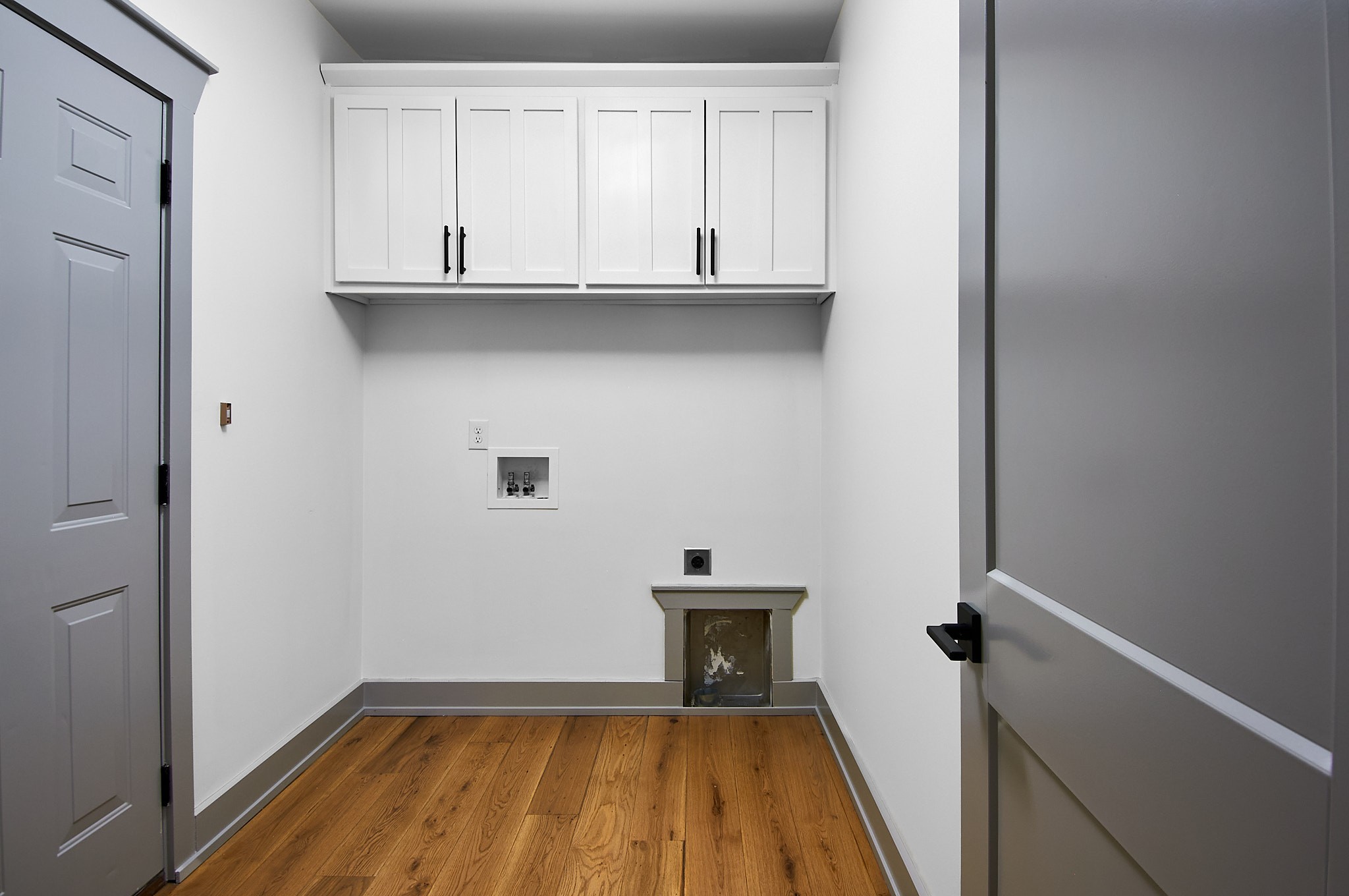 1461 Neelys Bend Road Madison, TN 37115 - Photo 33 of 38 Laundry with upper cabinets. Garage door on left.