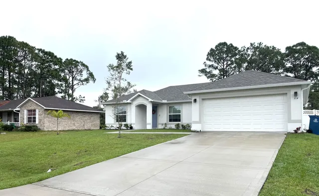 a view of yard with swimming pool