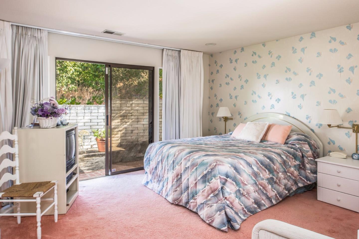 2900 Ribera Road Carmel, CA 93923 - Photo 13 of 18 a bedroom with a bed and large window