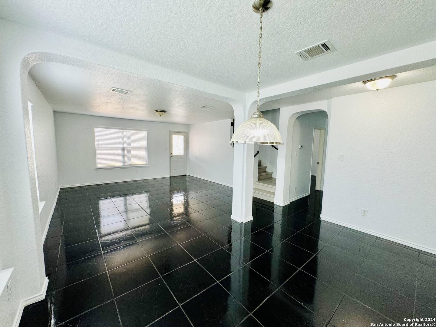 12139 Patton Point San Antonio, TX 78254 - Photo 14 of 34 a view of a hallway with wooden floor and windows