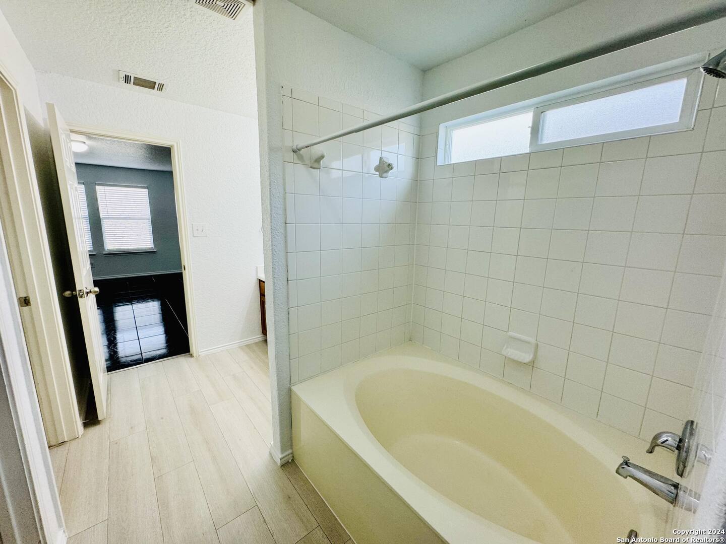 12139 Patton Point San Antonio, TX 78254 - Photo 18 of 34 a bath tub sitting next to a bathroom sink