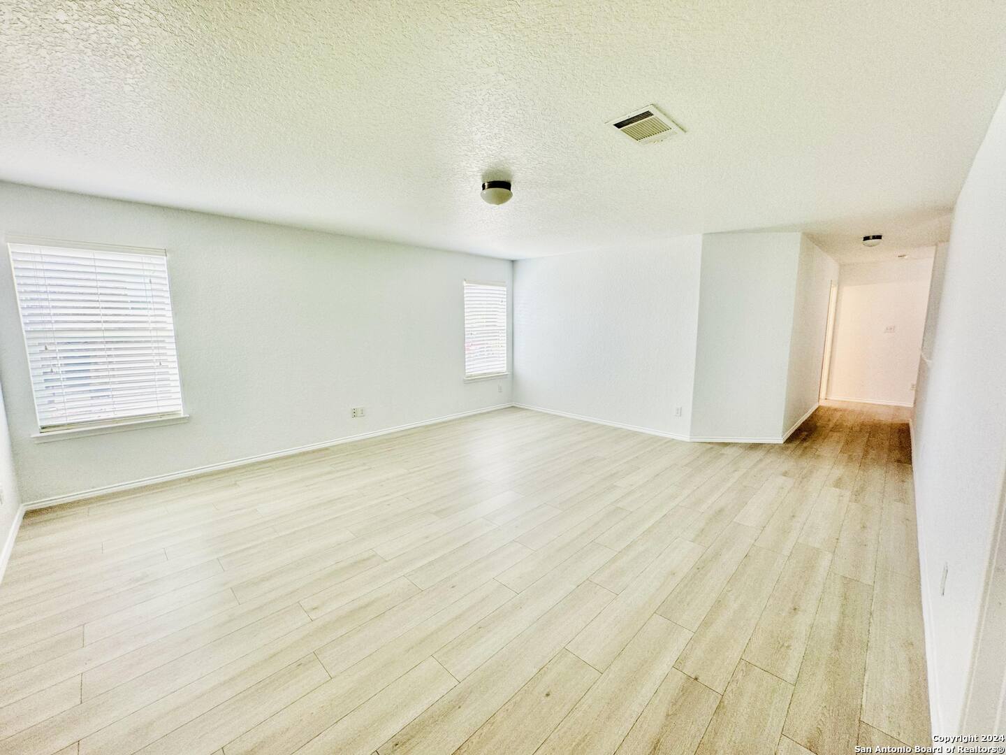 12139 Patton Point San Antonio, TX 78254 - Photo 29 of 34 a view of empty room with wooden floor