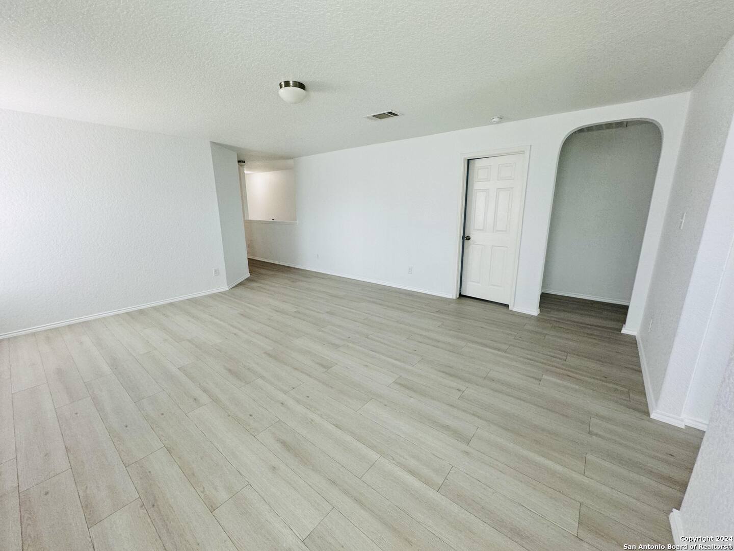 12139 Patton Point San Antonio, TX 78254 - Photo 31 of 34 a view of an empty room with wooden floor