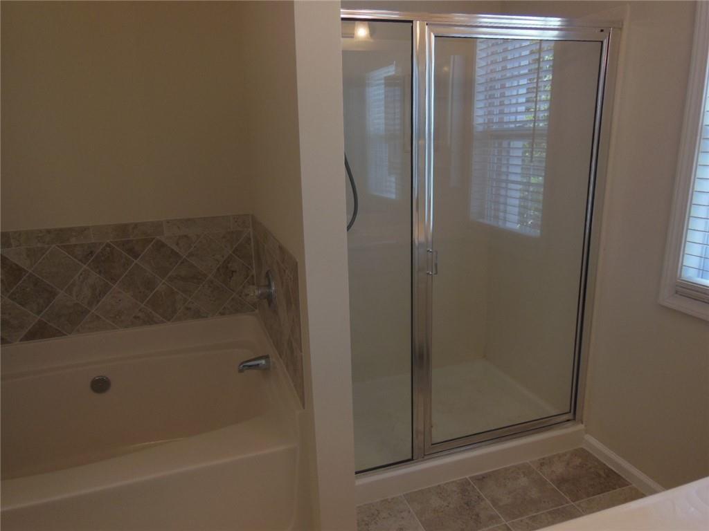2970 Wintercrest Trace Atlanta, GA 30360 - Photo 11 of 15 a bathroom with a glass shower door
