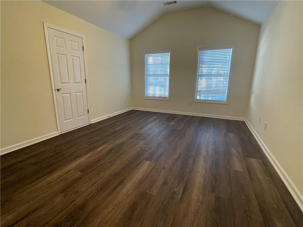 2970 Wintercrest Trace Atlanta, GA 30360 - Photo 15 of 15 an empty room with wooden floor and windows