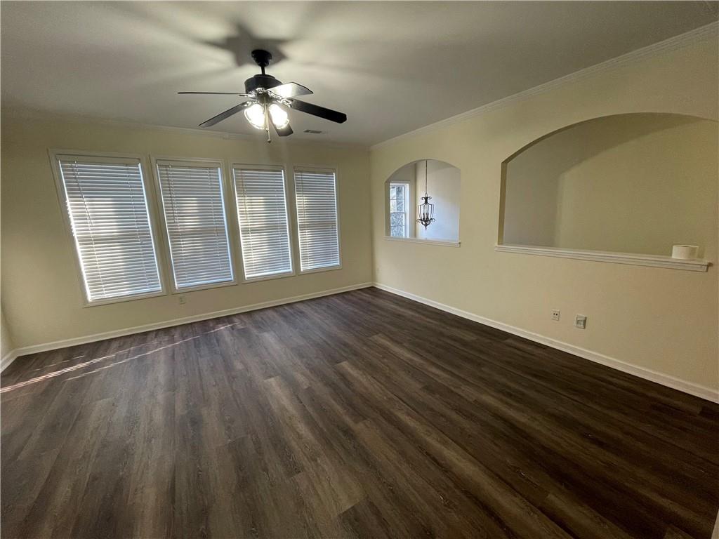 2970 Wintercrest Trace Atlanta, GA 30360 - Photo 4 of 15 a view of an empty room with a window and wooden floor