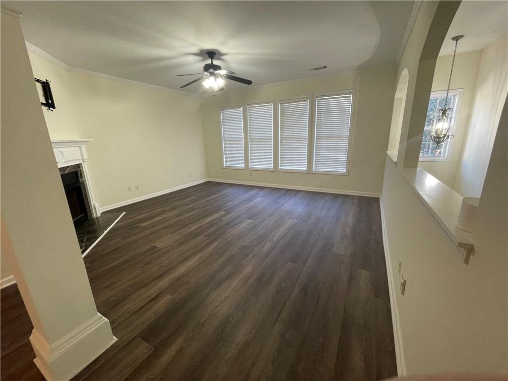2970 Wintercrest Trace Atlanta, GA 30360 - Photo 5 of 15 a view of an empty room with wooden floor and a window