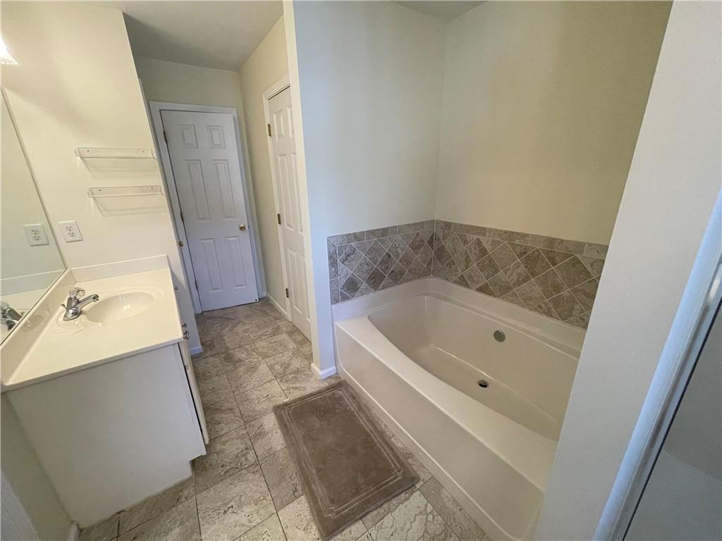 2970 Wintercrest Trace Atlanta, GA 30360 - Photo 10 of 15 a bathroom with a bathtub and a sink