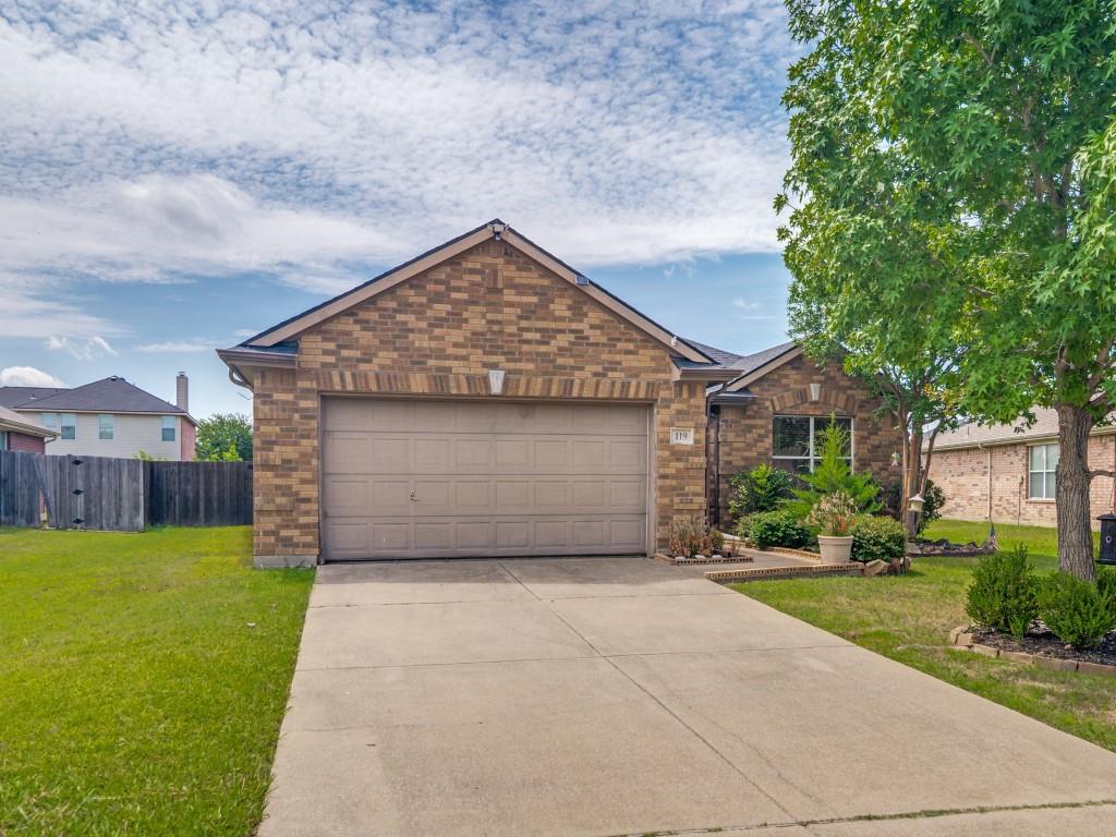 119 Robin Lane Forney, TX 75126 - Photo 2 of 27 Brick exterior with an attached two-car garage, concrete driveway, and front landscaping
