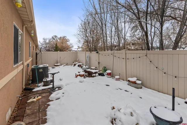 a view of a terrace with chairs and a fire pit
