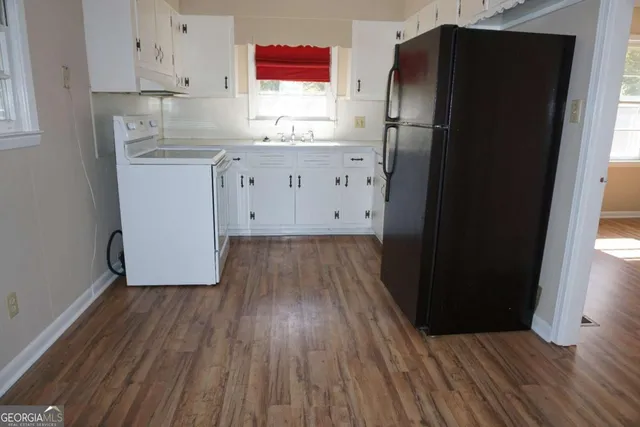 a refrigerator freezer sitting inside of a kitchen