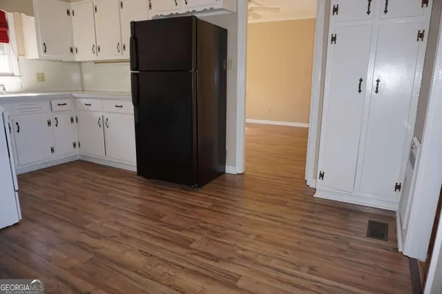 a stove top oven sitting inside of a kitchen