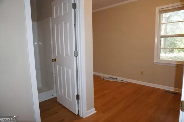 a bathroom with a toilet and shower