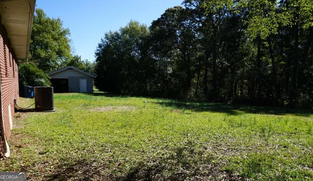 a view of a yard with a trees