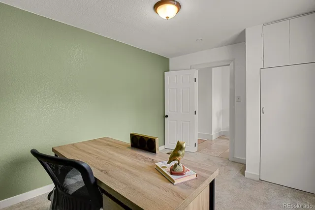 a view of a workspace with furniture