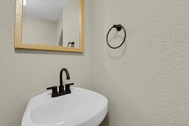 a view of a chair and table on the deck