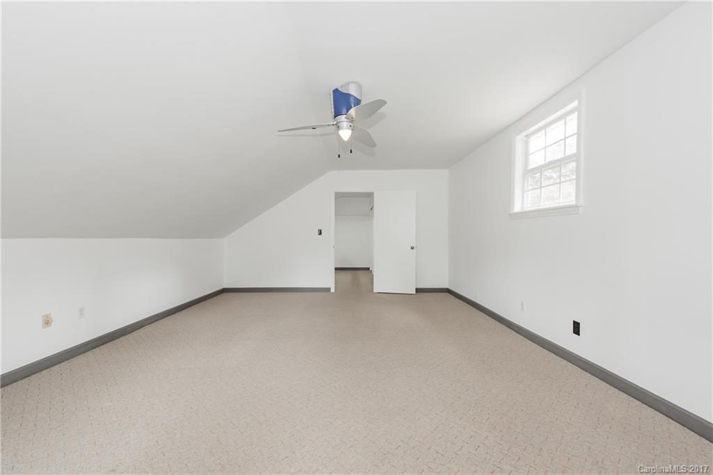 5423 Londonderry Road Charlotte, NC 28210 - Photo 14 of 16 an empty room with a window and a ceiling fan