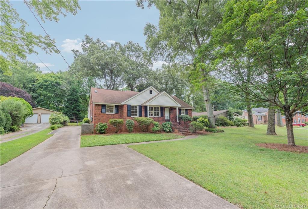 5423 Londonderry Road Charlotte, NC 28210 - Photo 16 of 16 a view of a house with a big yard and large trees