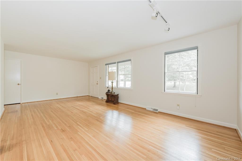 5423 Londonderry Road Charlotte, NC 28210 - Photo 3 of 16 an empty room with wooden floor and windows