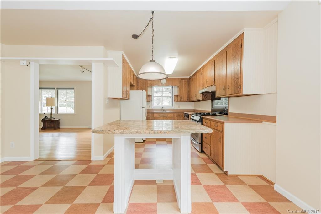 5423 Londonderry Road Charlotte, NC 28210 - Photo 5 of 16 a kitchen with stainless steel appliances granite countertop a refrigerator and a stove top oven