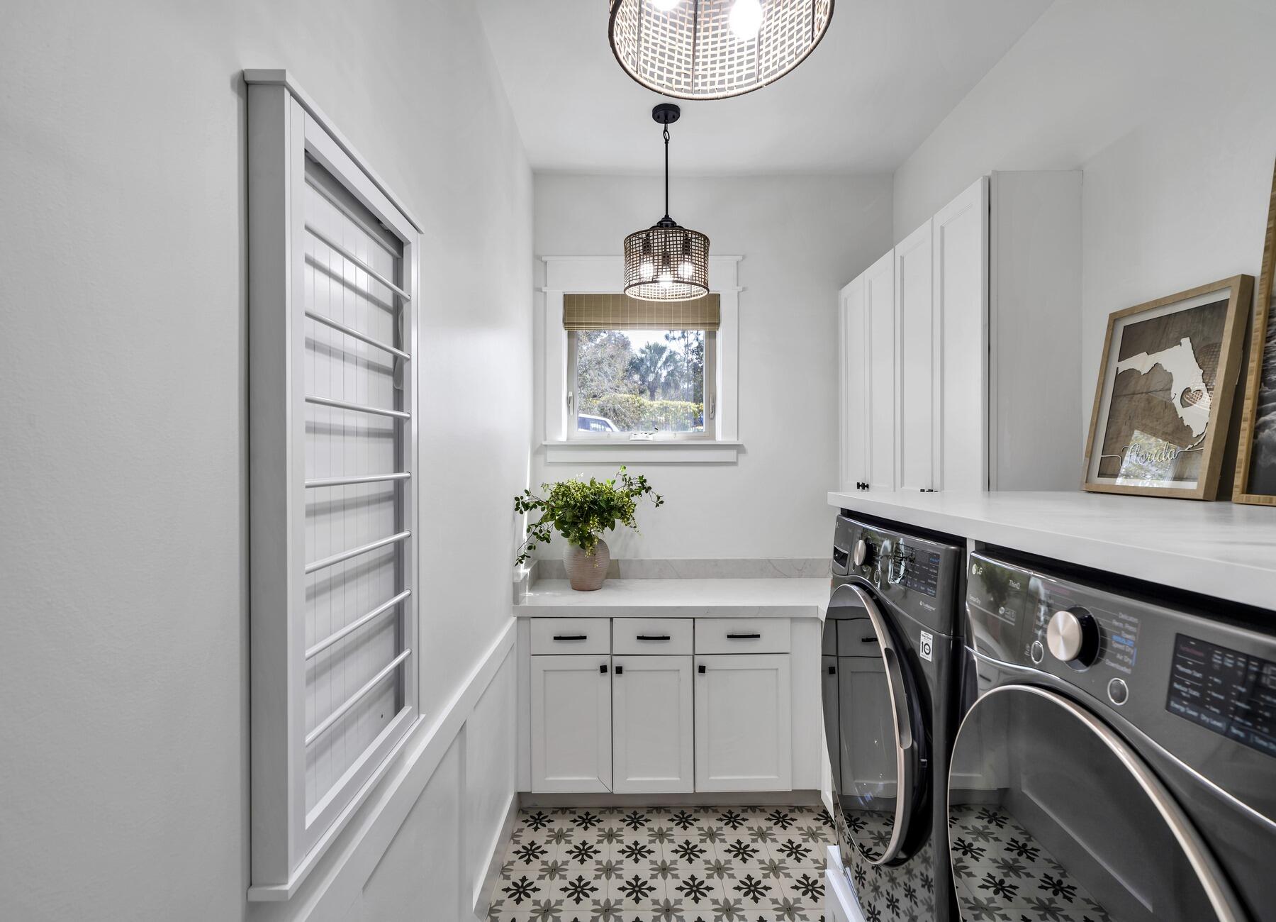 172 Baird Road Santa Rosa Beach, FL 32459 - Photo 20 of 46 a utility room with cabinets washer and dryer