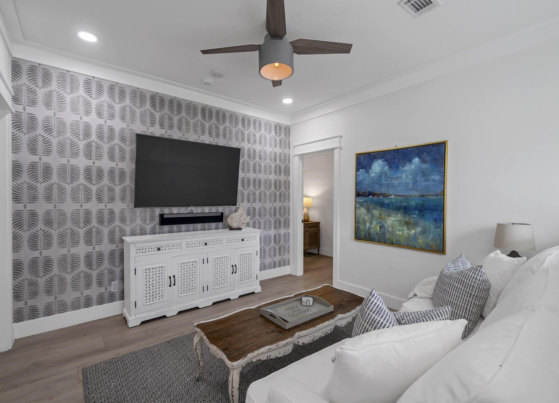 172 Baird Road Santa Rosa Beach, FL 32459 - Photo 23 of 46 a living room with furniture and a flat screen tv