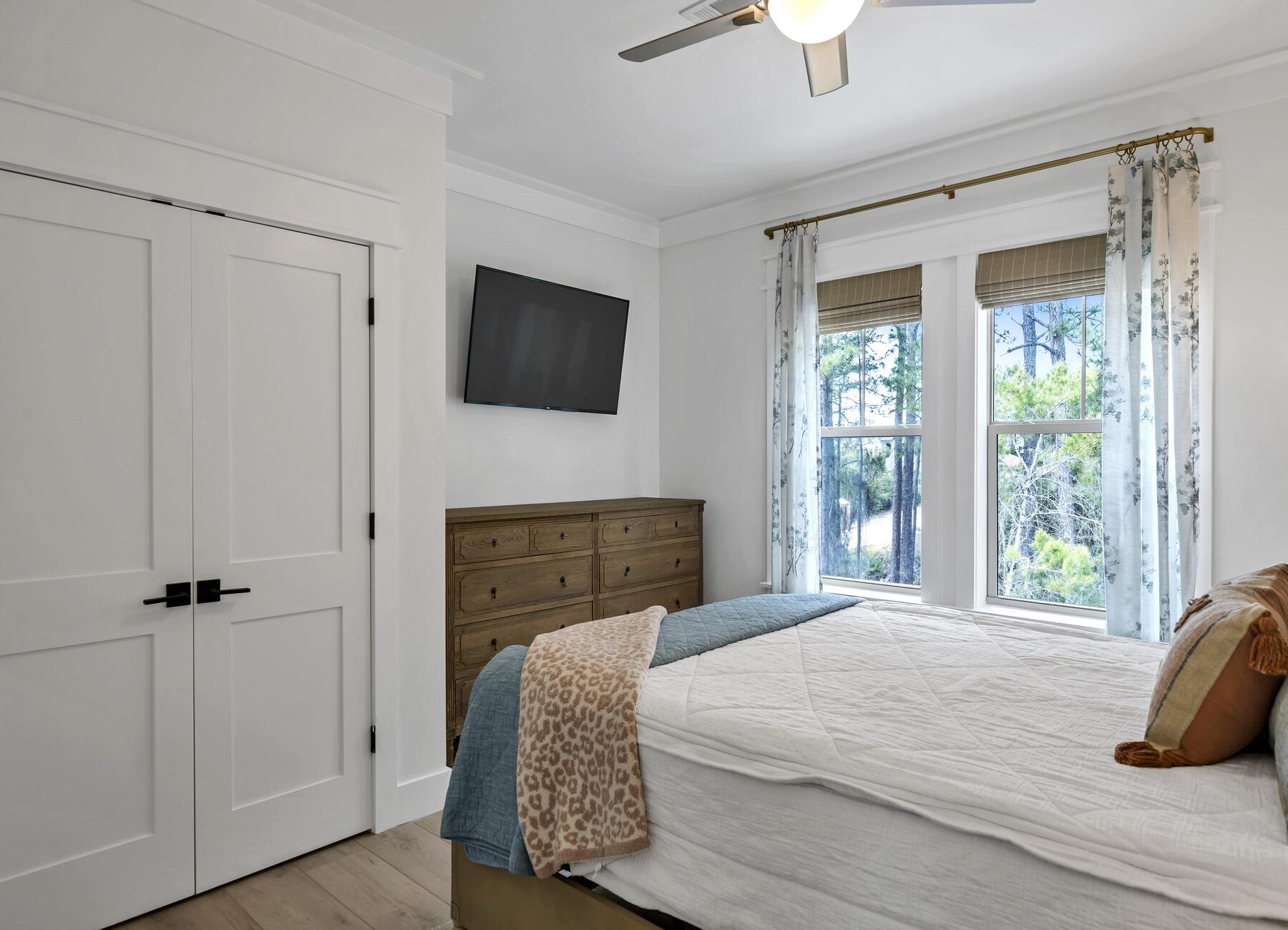 172 Baird Road Santa Rosa Beach, FL 32459 - Photo 25 of 46 a bedroom with a bed a window and a fireplace