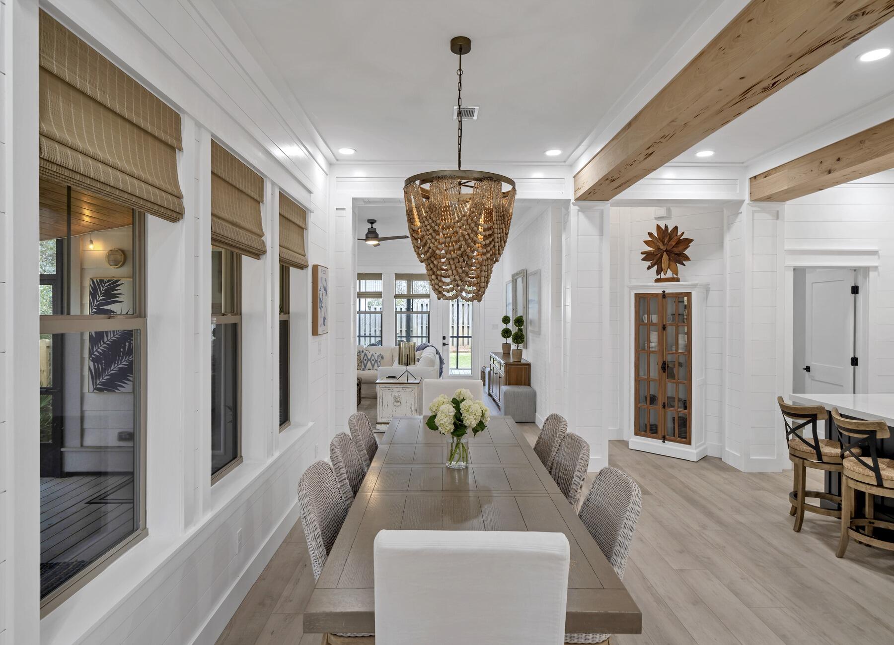 172 Baird Road Santa Rosa Beach, FL 32459 - Photo 3 of 46 a view of a dining room with furniture window and wooden floor