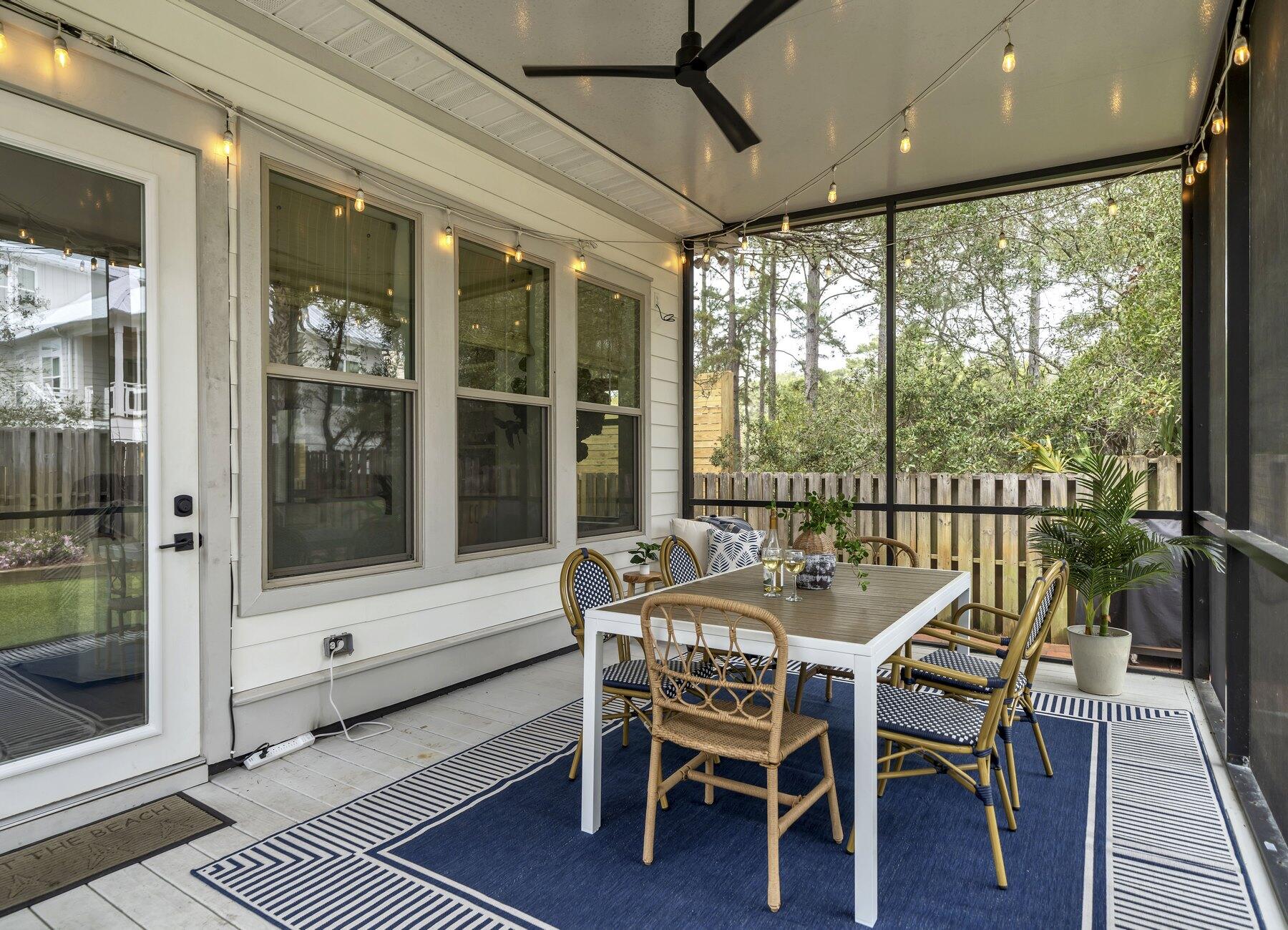 172 Baird Road Santa Rosa Beach, FL 32459 - Photo 32 of 46 a dining room with furniture window and wooden floor