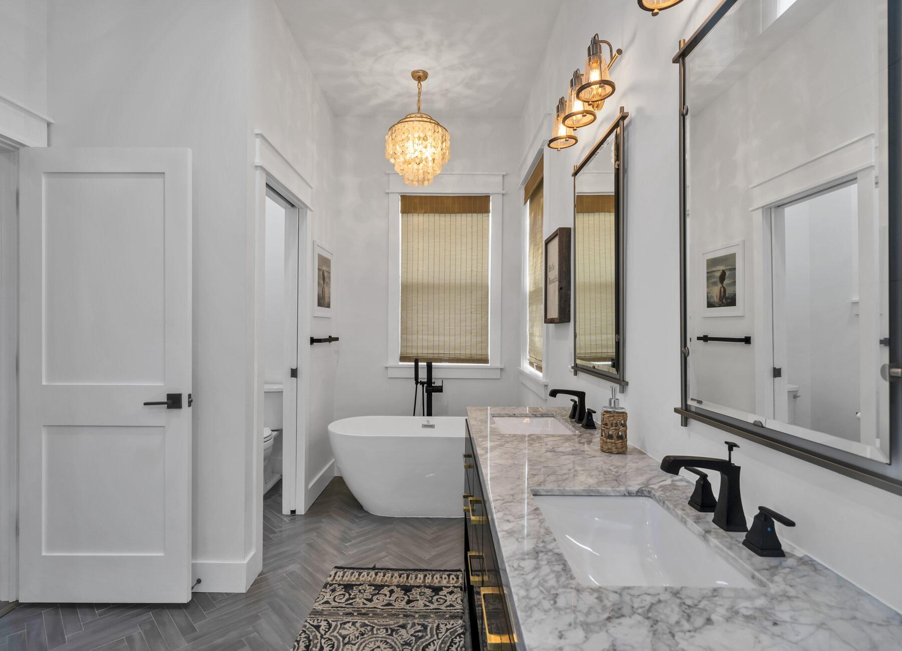 172 Baird Road Santa Rosa Beach, FL 32459 - Photo 4 of 46 a spacious bathroom with a bathtub a mirror and a shower