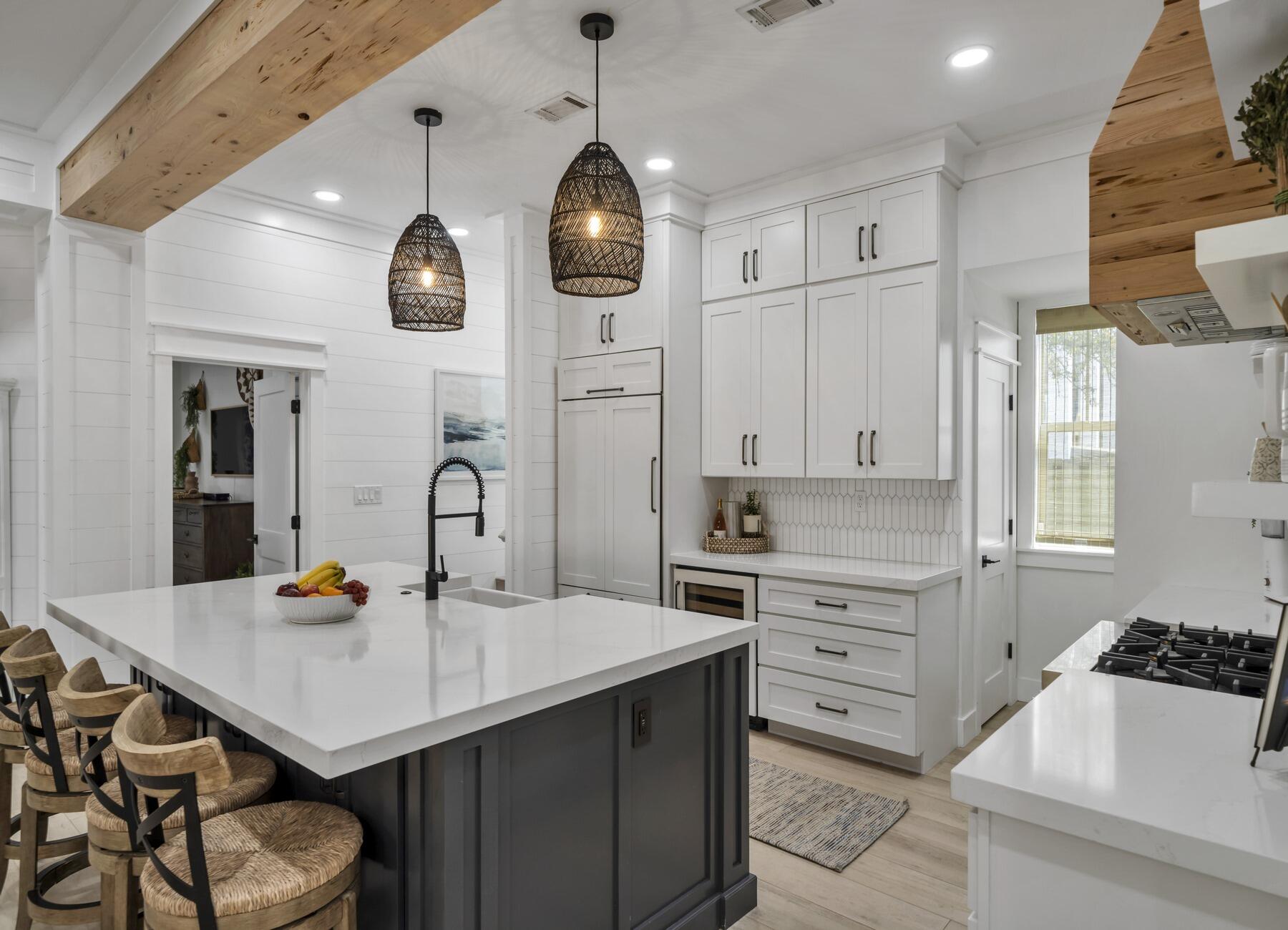 172 Baird Road Santa Rosa Beach, FL 32459 - Photo 9 of 46 a kitchen with a sink a stove and chairs