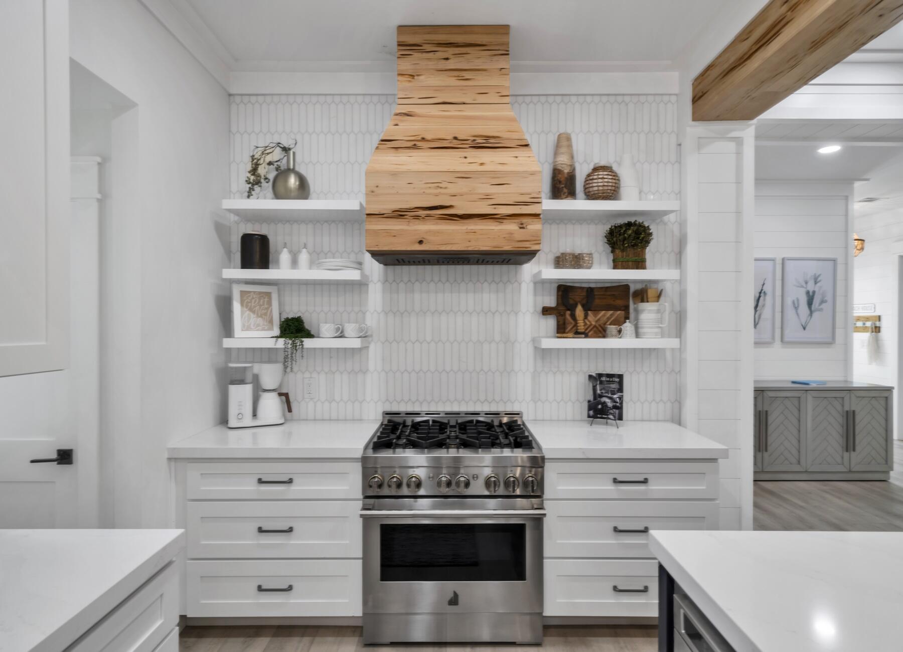 172 Baird Road Santa Rosa Beach, FL 32459 - Photo 10 of 46 a kitchen with stainless steel appliances a stove and cabinets