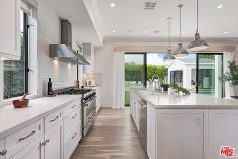 a living room with furniture a piano and a window