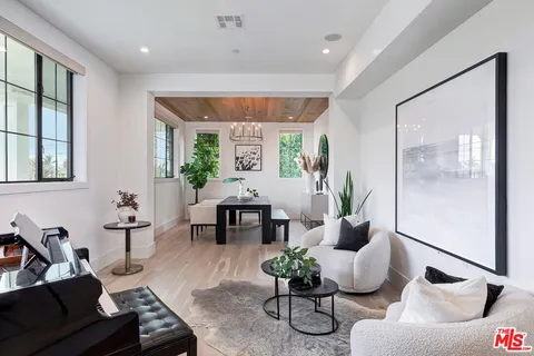 a view of a livingroom with furniture and a potted plant