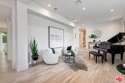 a bedroom with a bed and glass window