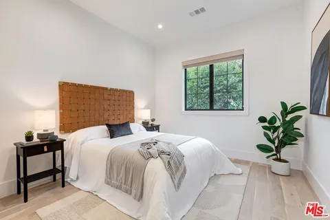 a view of swimming pool with a lounge chairs