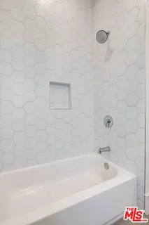 a view of swimming pool with a table and chairs in balcony