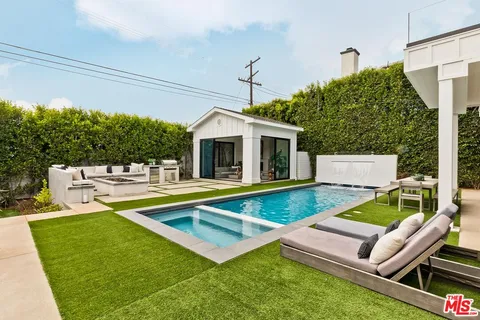 a front view of a house with swimming pool