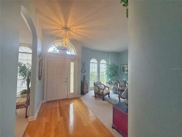 an aerial view of residential house with outdoor space and lake view