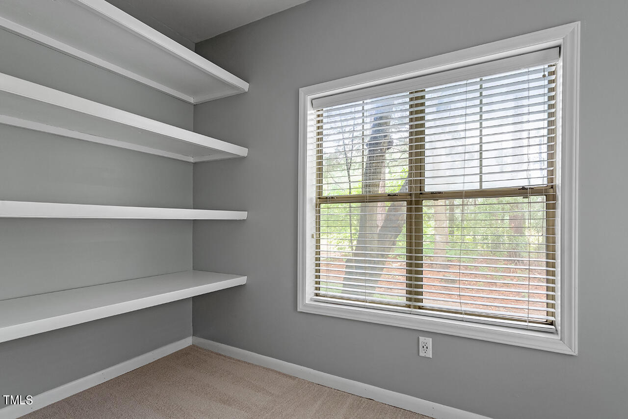 6011 Winterpointe Lane, Unit 104 Raleigh, NC 27606 - Photo 25 of 31 a view of room and window