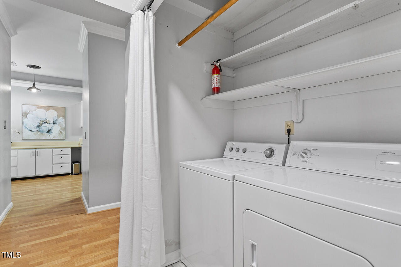 6011 Winterpointe Lane, Unit 104 Raleigh, NC 27606 - Photo 28 of 31 a utility room with dryer and washer